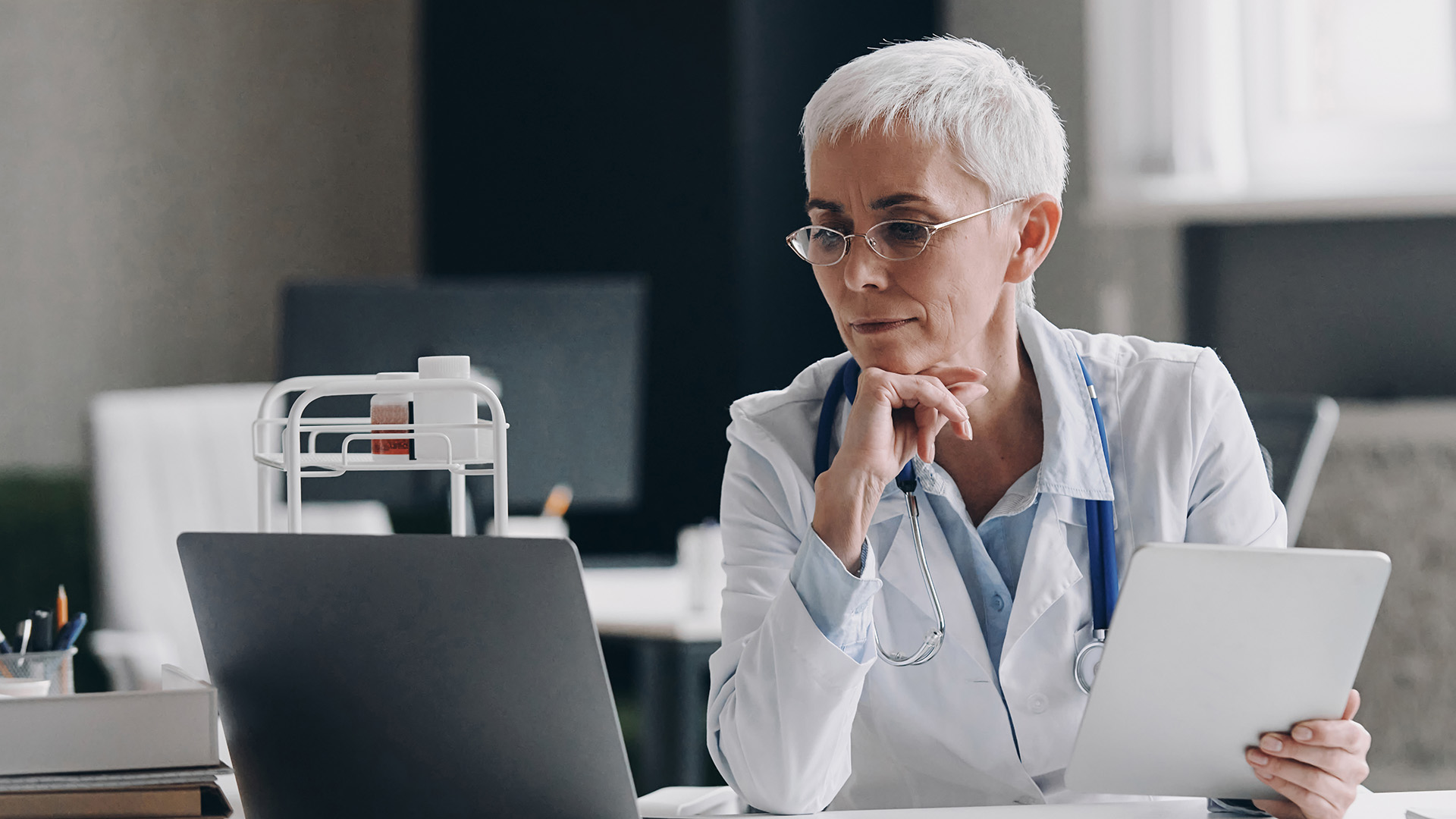 Bookkeeping for medical practices with a clinic owner reviewing financial information